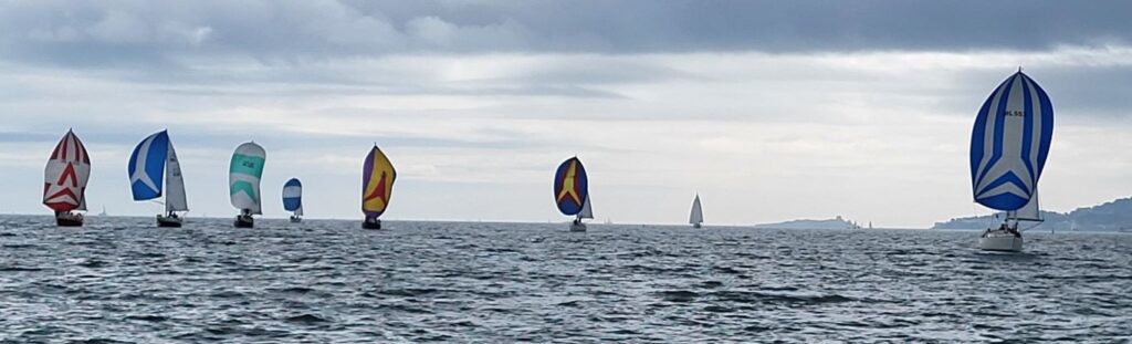 Shipman boats under spinnaker